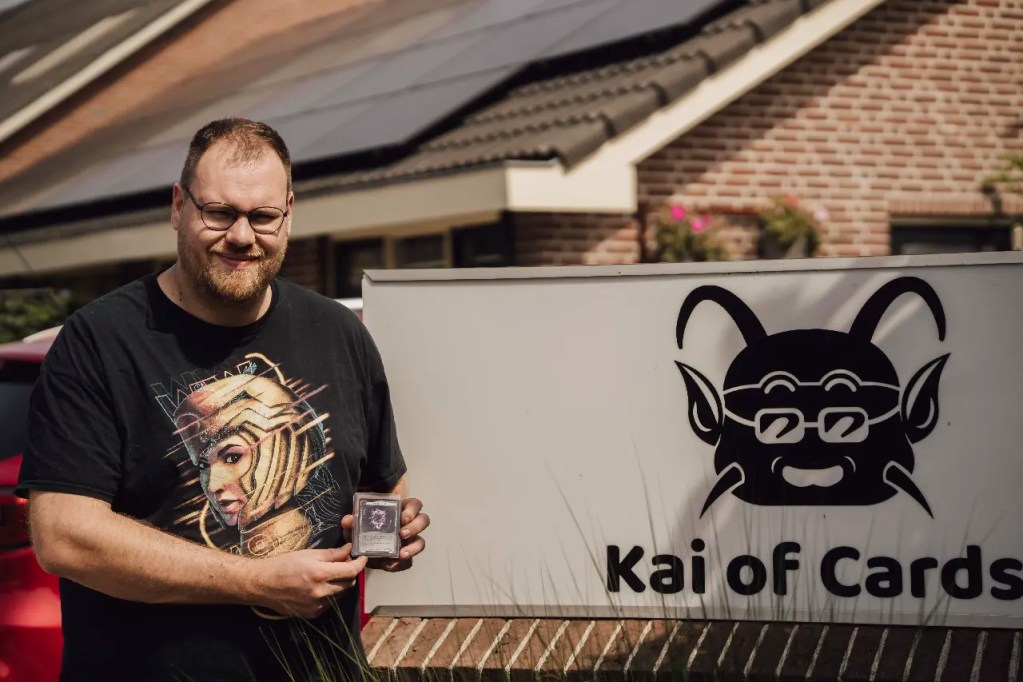 Corné van Dooren holding the Arknight Shard Cold Foil outside Kai of Cards store in Ederveen, Light and Relic provenance project.