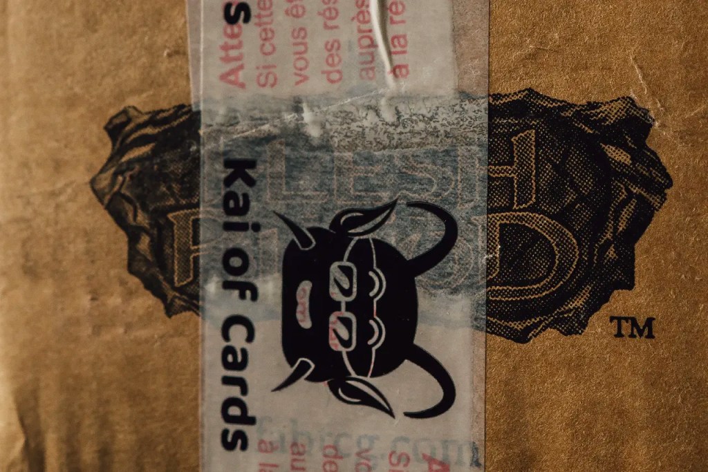 Close-up of Flesh and Blood shipping case with Kai of Cards tape, Crucible of War First Edition 2020