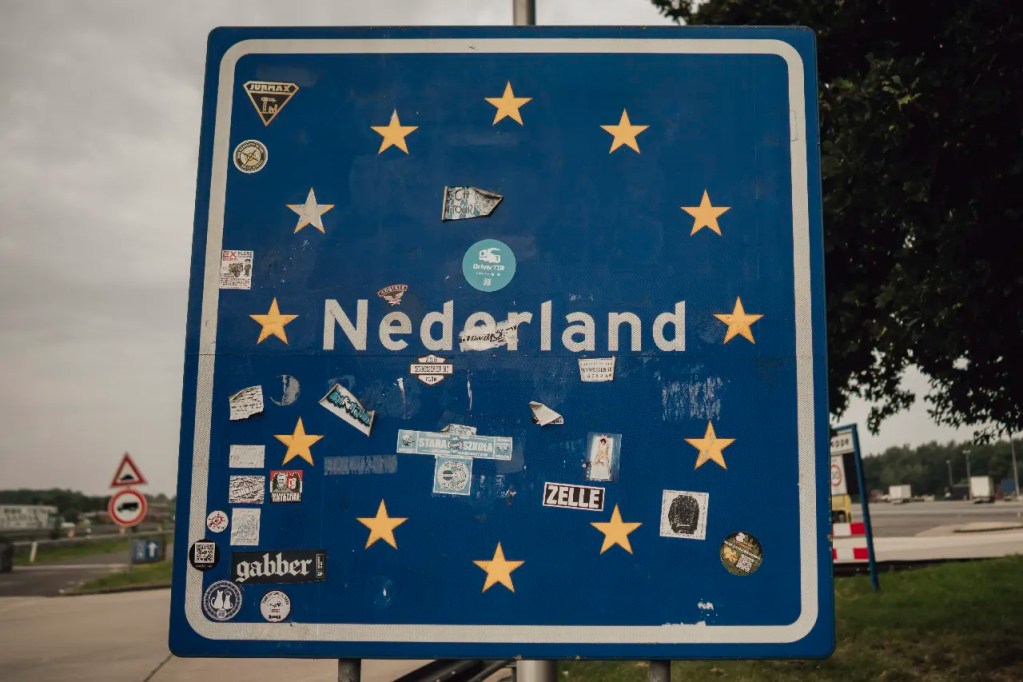 Netherlands border sign during Arknight Shard provenance journey to Kai of Cards, Light and Relic Flesh and Blood project.